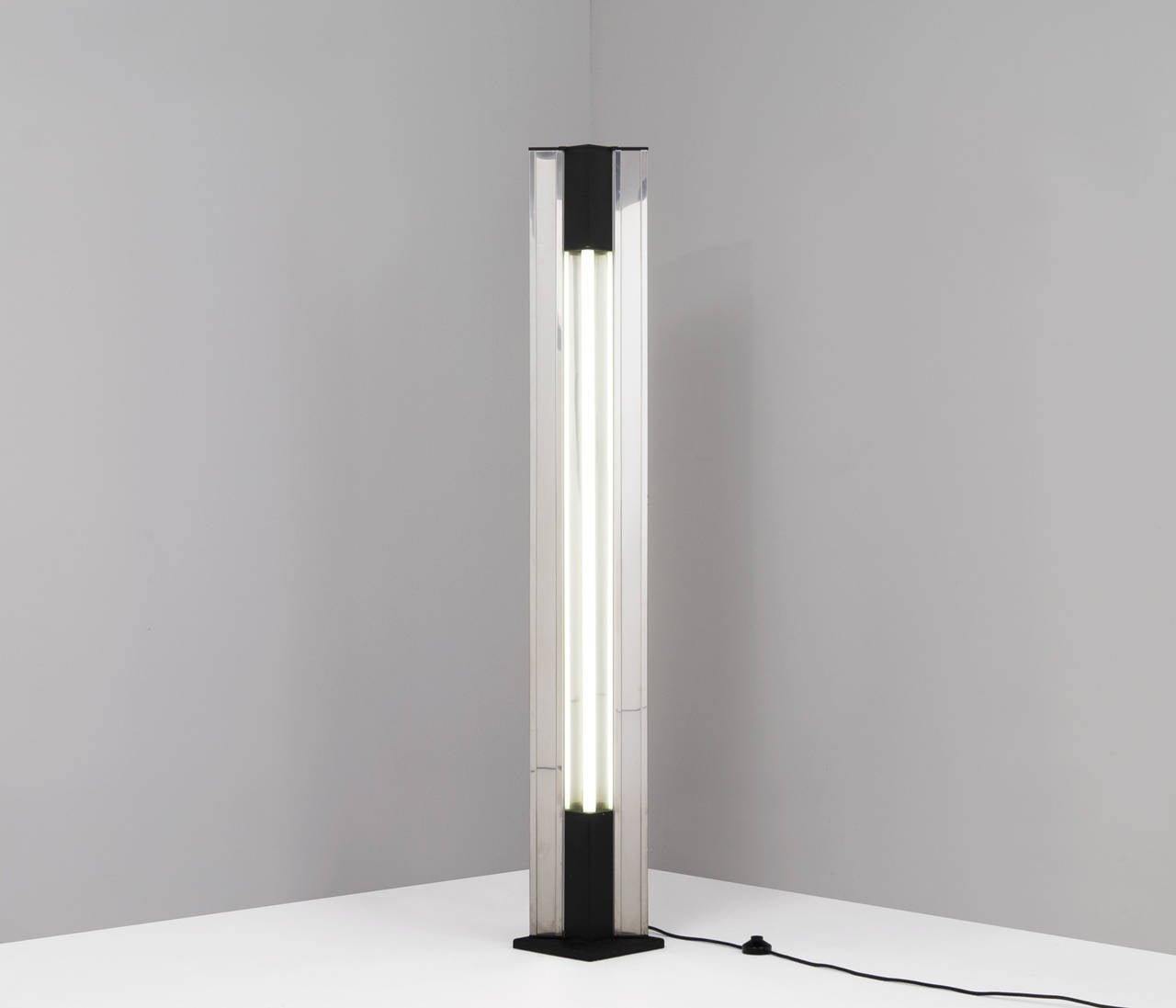 Rare Moonlight floor lamp, designed by Ettore Sottsass in Italy, circa 1970.

This basic shaped floor lamp shines a very interesting and atmospheric light. Due to the vertical thin lines in the metal fixture, the diffuse light on its surrounding