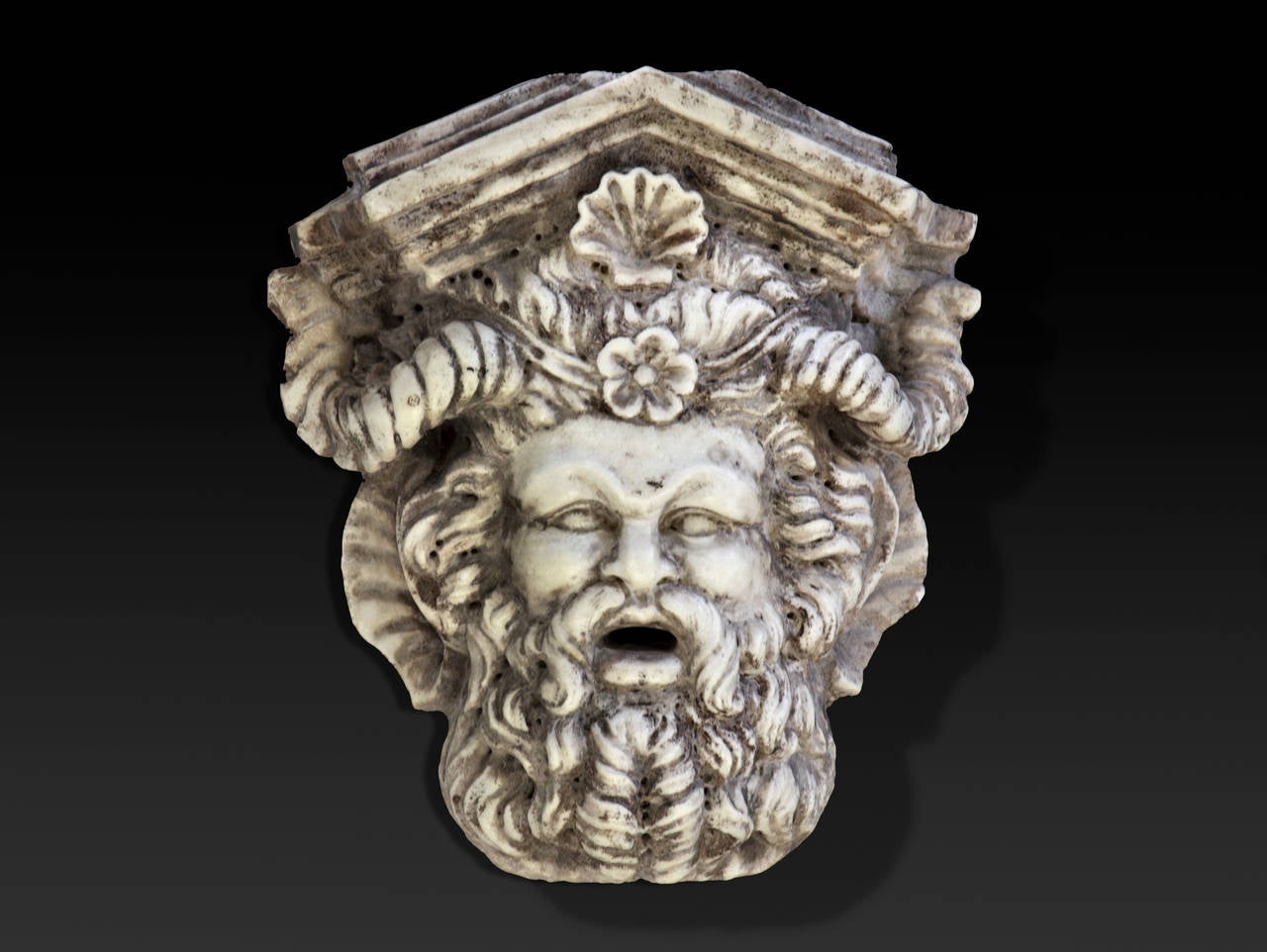 20th century, the horned and bearded visage beneath a pediment, the open mouth as the water aperture.