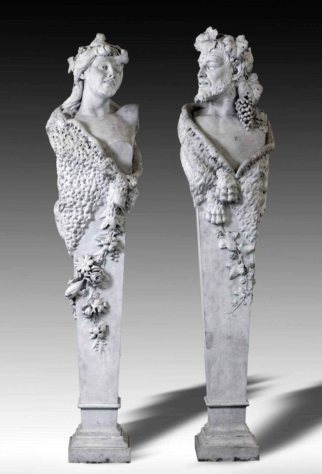 Follower of James Pradier (French 1790-1852), a pair of sculpted white marble herm figures representing Bacchus and a Bacchante in neoclassical style, late 19th century, modelled as opposing, teh former with head turned to dexter, the latter facing
