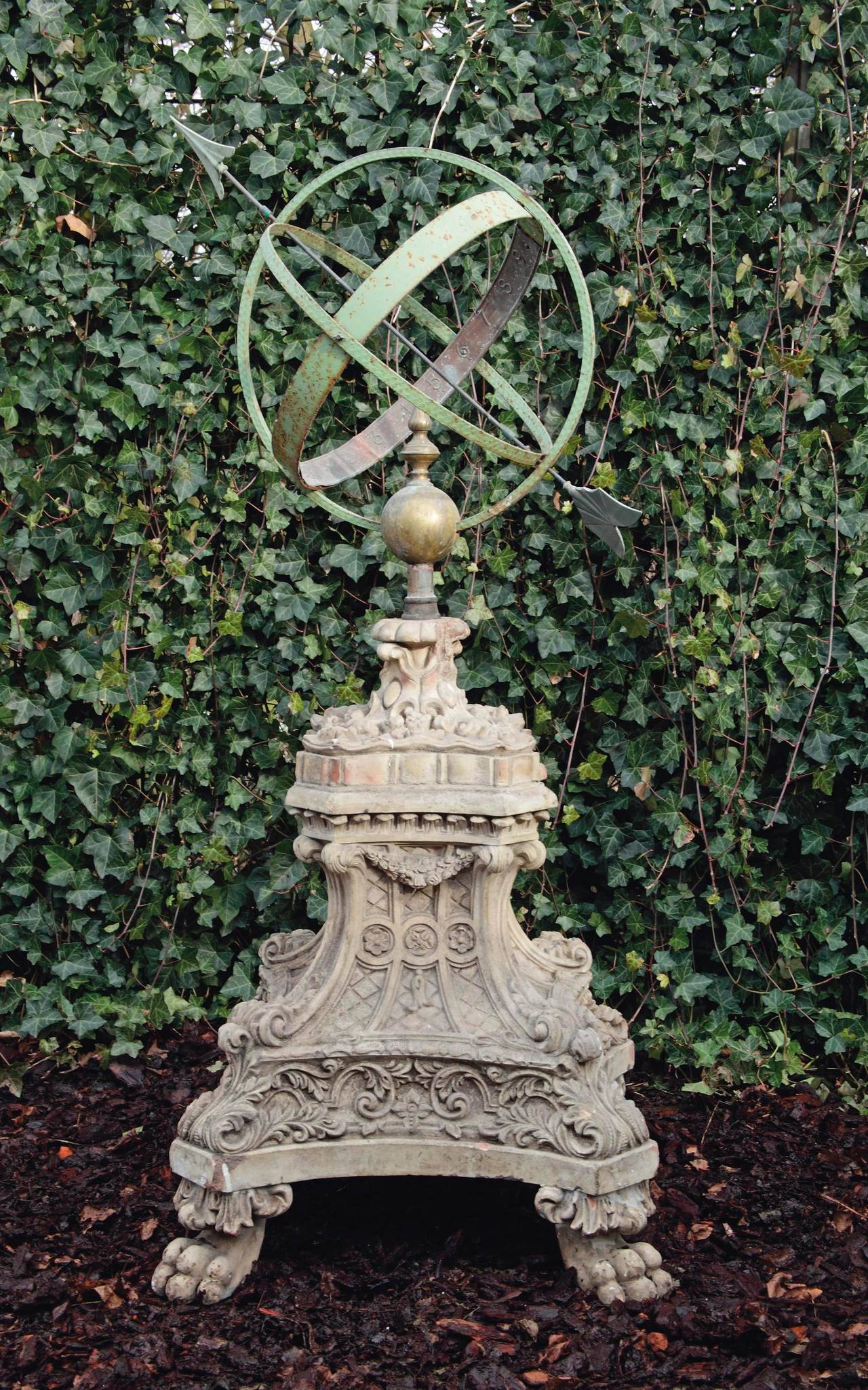 The sphere is early 20th century and the terracotta base 19th century.

The pedestal is beautifully decorated and is standing on four paw feet. Because of the vulnerable material there are a few small restorations to the pedestal.