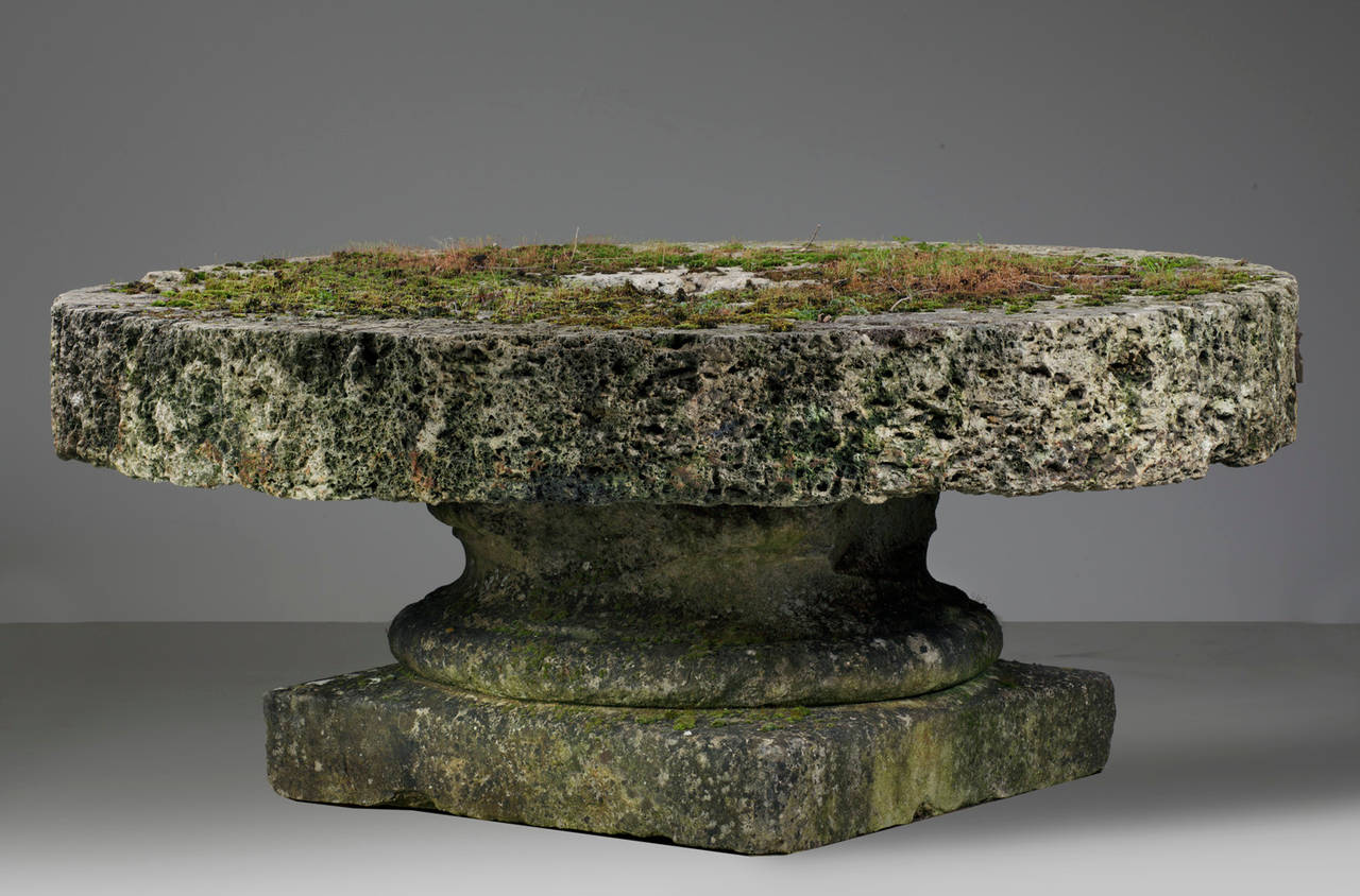 Limestone 19th Century French Rough Hewn Circular Millstone as a Garden Table