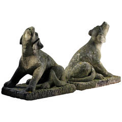 Pair of Carved Limestone Models of Howling Dogs