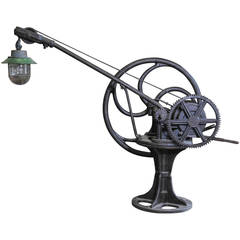 A large early 20th C. French Industrial iron crane remade into a lamp socket
