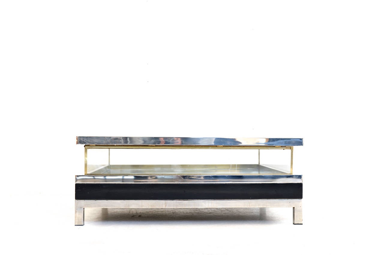 Impressive sliding top coffee table with interior display
chromed steel / brass / black lacquer
This is the most high end edition of this type of coffee table.

we have worldwide shipping solutions
L 108 / 154 cm x D 108 cm x H 42 cm
France ,