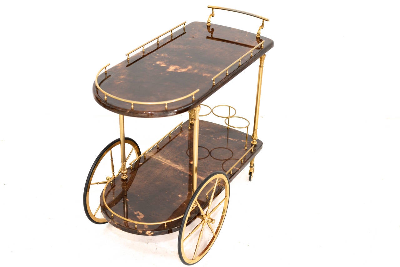 Lacquered goatskin  & Brass bar trolly
by Aldo Tura 
Marked by Aldo Tura

we have worldwide shipping solutions
