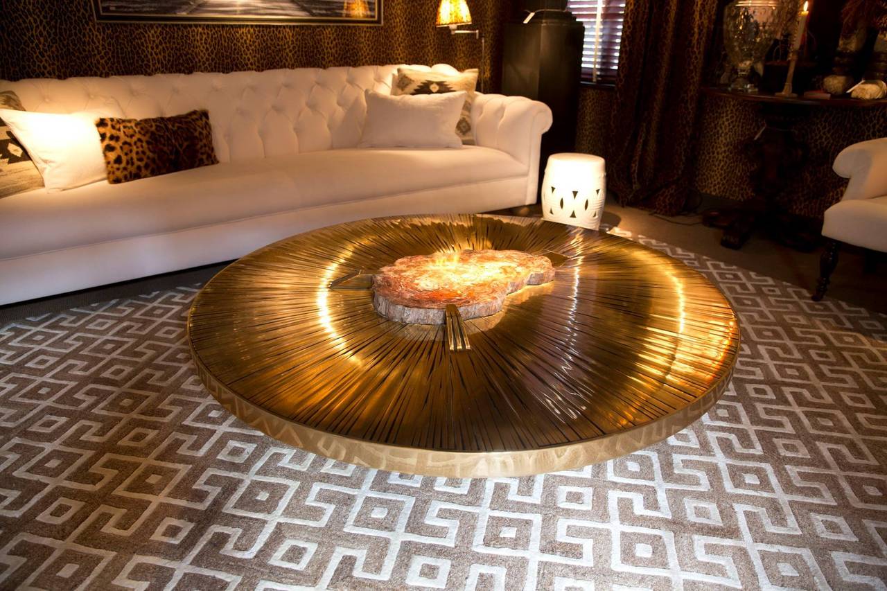 This is a piece unique by Belgian Artist Dessauvages
inspired by great designers as Ado Chale , Jean - Claude Dresse , Willy Daro , Lova Creations.

Circular cocktail table with an impressive piece of petrified wood in the center.
signed by the
