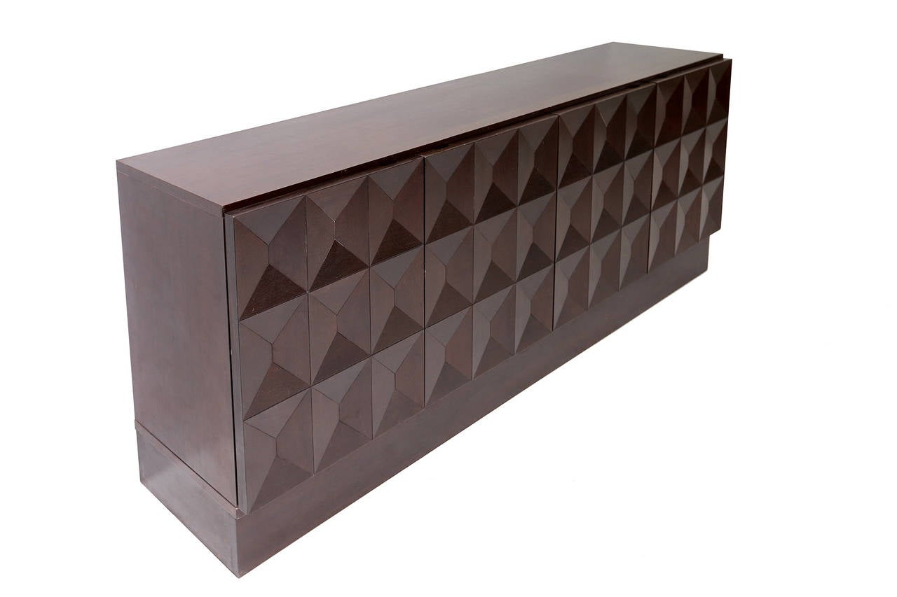 Brutalist 1970s credenza with diamond shaped door panels.

we have worldwide shipping solutions