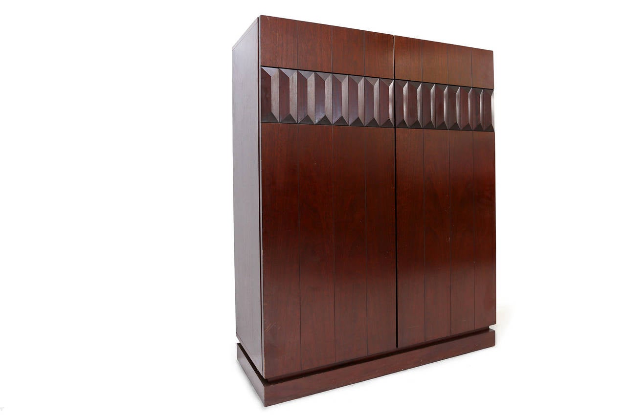 Mahogany Bar Cabinet
geometrically shaped door panels

we have worldwide shipping solutions