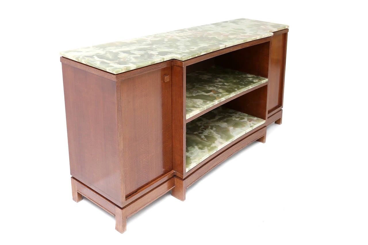 Early credenza by Emiel Veranneman,
one of the most important Belgian designers
impressive pieces of green onyx marble.
Check out our Goldwood Storefront for more matching pieces.