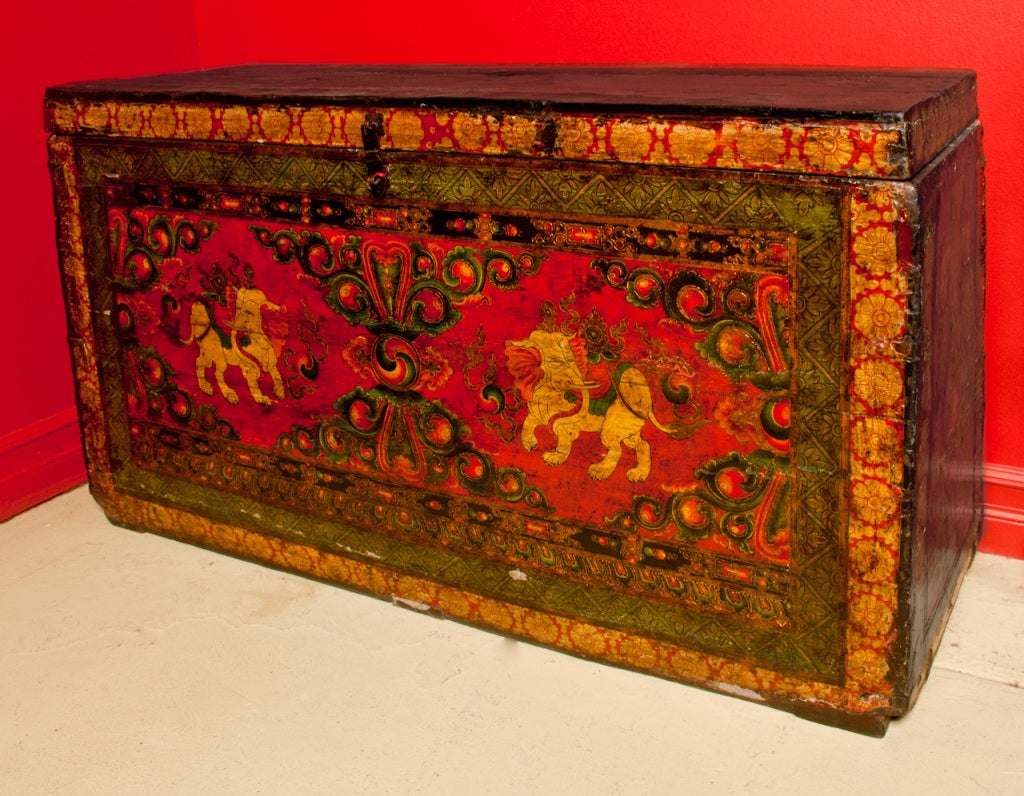 A 19th century Tibetan trunk with original painting, in good condition, with original hardware. The painting depicts two elephants, which are considered guardians of temples and of the Buddha himself. The material is  wood, probably pine. It has