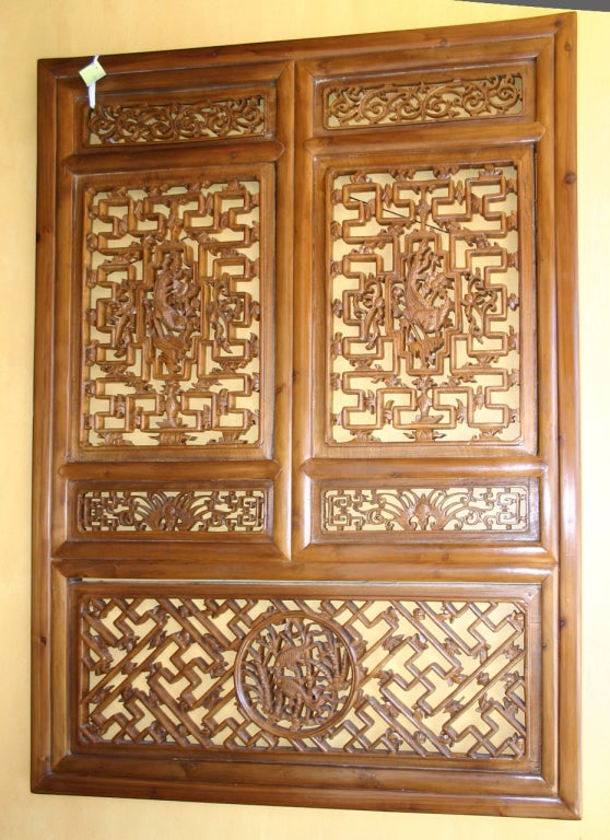 19th century nanwood window with frame. Rescued from a Chinese home being demolished, this is a work of art. The carving is exquisite and original representing the skill of Chinese craftsmen in creating varieties of fretwork. It can be hung as a