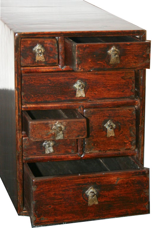 18th century miniature nanwood medicine chest with 7 drawers of variable sizes. Simple hardware makes this a lovely piece. Perfect for a jewelry box or to hold other treasures.