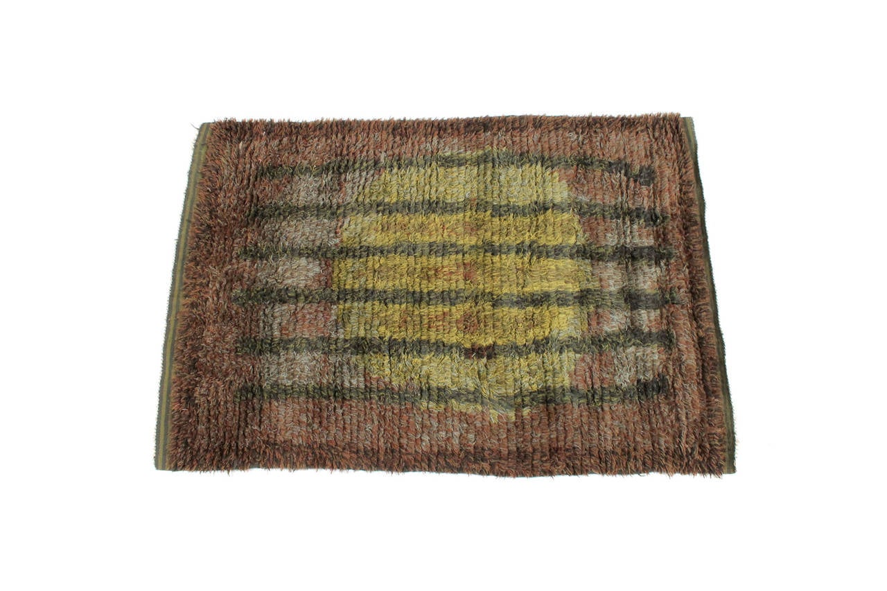 Finnish rya rug or wall hanging with high pile. Geometric design of six stripes and large circle. Bold and attractive hues of green and brown. Recently professionally cleaned.
