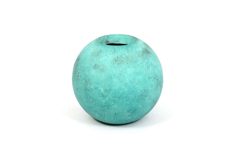 1960s fiberglass orb planter or vase with a green verdigris painted texture to its body.  This vase has minute drilled holes in the base for outdoor use.  It also could be successfully used indoors as well.