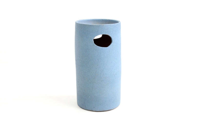 Standing ceramic vessel that could be used as a catch all bowl or umbrella Stand. Strong architectural form.