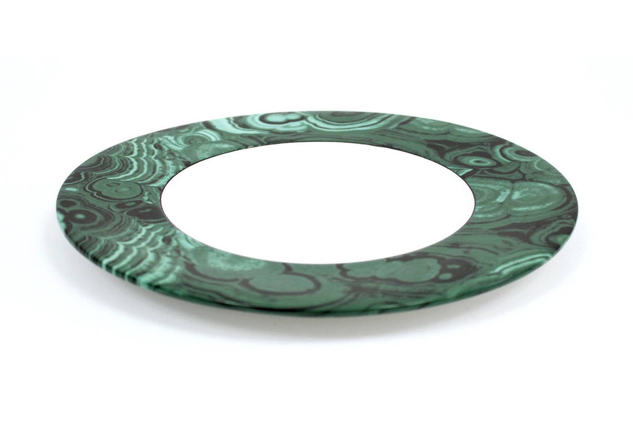 Graphic set of ceramic dinner plates with rims patterned after the mineral malachite. 1970s Italian made. Very reminiscent of the work of Piero Fornasetti. Malachite design is unique from one plate to the next. A bold addition to your table setting.
