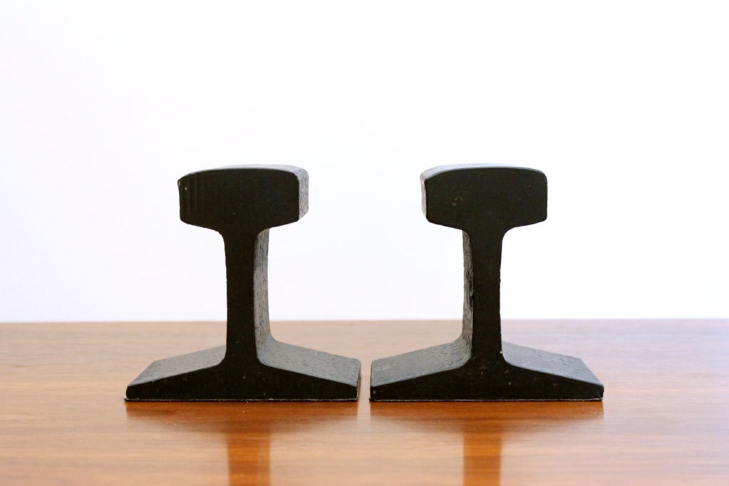 Pair of railroad rail bookends. Simple industrial forms reminiscent of the sculptural work of the American artist James Prestini.