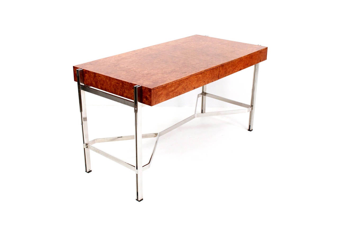 Heavily figured amboyna burl wood and steel writing desk designed by Leon Rosen for Pace Collection. Desk features two pull-out drawers and architectural stainless steel frame. Great scale for a home office.
