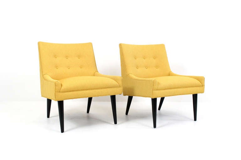 Pair of Harvey Probber slipper lounge chairs. Recently upholstered in Maharam fabric with black painted cylindrical legs.  Comfortable and attractive pair of well styled chairs.