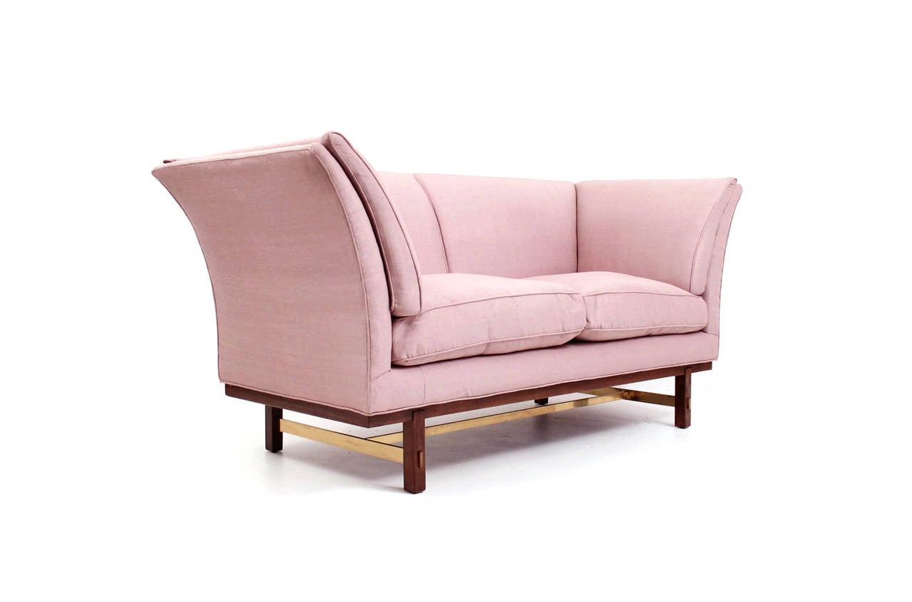 Edward Wormley for Dunbar gondola settee. Sculptural upholstered form with down cushions on a base of brass and wood. Elegant and comfortable piece.