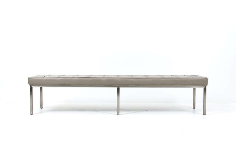 Matched pair of 7 foot tufted leather benches on stainless steel frame.  Metal decal to underside.  Design is very similar to its Knoll equivalent.  Sold as a pair or individually, priced individually at $3800.