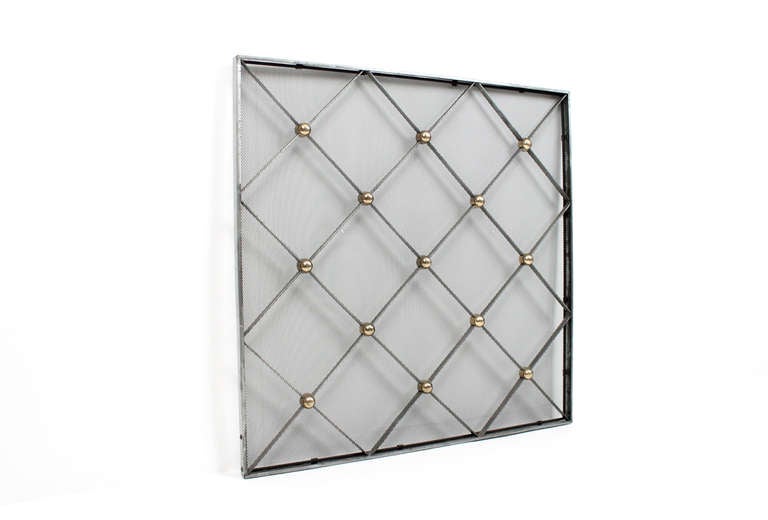 Chrome and brass fire screen or fireplace cover in the style of French designer Jean Royere. Attractive statement for the fireplace with a criss crossing diamond pattern.
