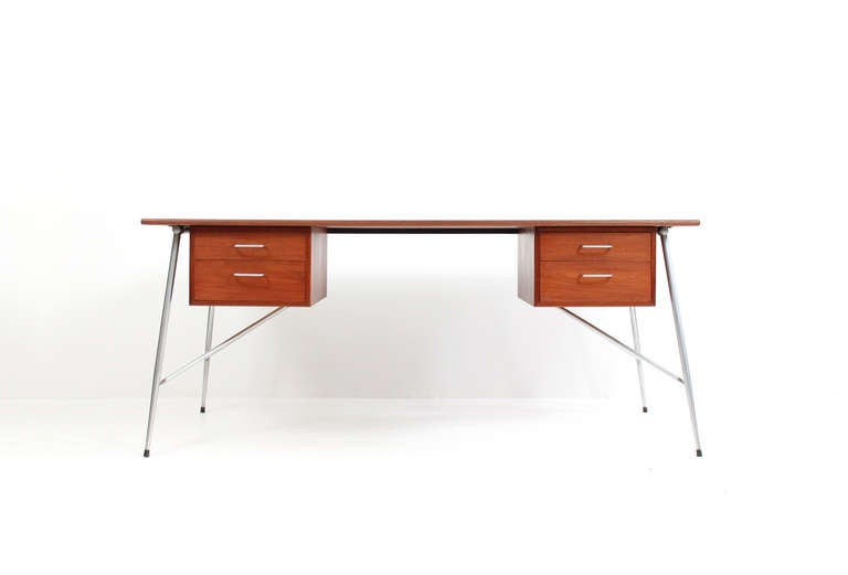 Rare desk by Borge Mogensen for Soborg Mobler.  Desk features a teak top and 2 teak pedestals of drawers supported by an architectural steel leg structure.