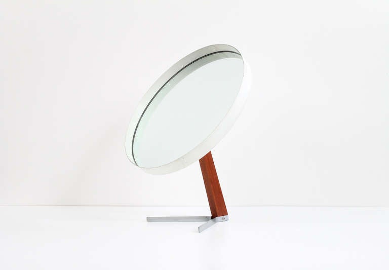 Superb table or vanity mirror in the style of the Swedish company Luxus. This particular example in teak, painted metal, and steel. Produced by Durlston in the 1960s.  Attractive cantilevered design and useful form.