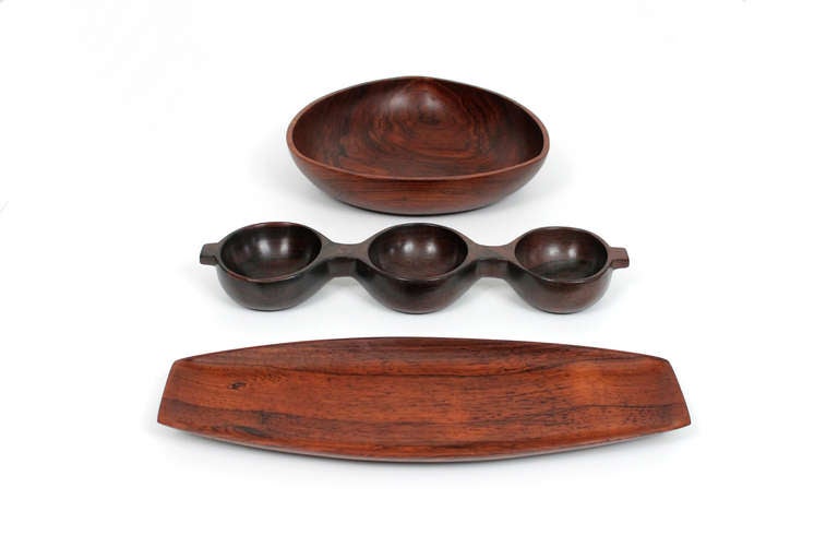 Expressive group of three Brazilian rosewood bowls from the Lunning Collection. Two examples branded to underside. Third examples retains remnants of the sticker of the Copacabana boutique where the pieces were likely purchased. Dimensions below are
