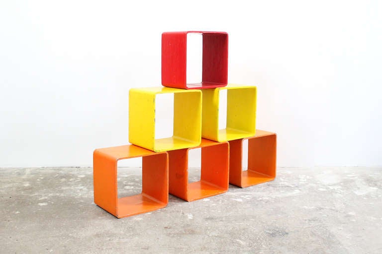 Set of artist made brightly colored tables/storage cubes from the 1970s.  Can be arrange in numerous ways to act as tables, a shelving system, or sculpture. Priced individually at $150.