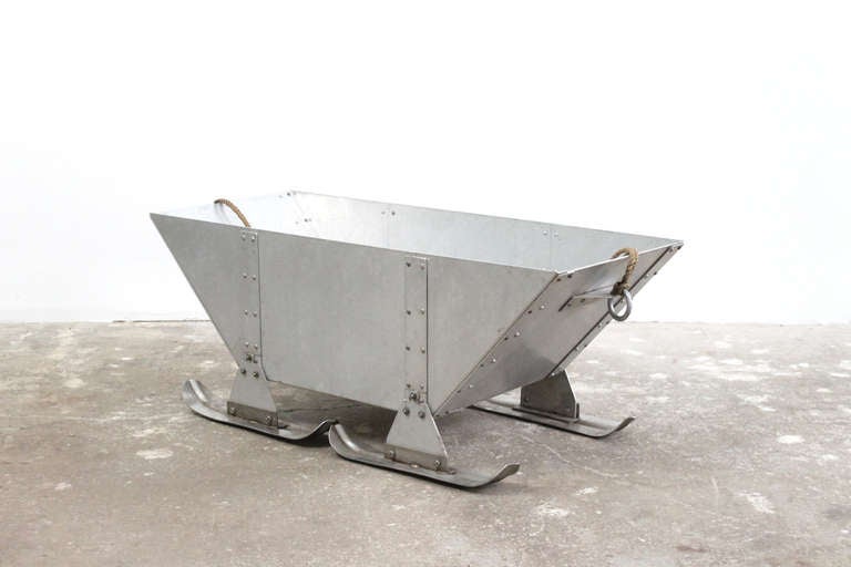 Machine Age riveted aluminium log caddy. This sled was originally designed to be used in the collection of maple syrup.