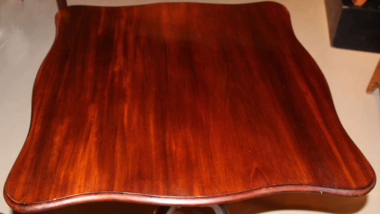 This mahogany Chippendale Serpentine tilt top tea table is supported by an urn turned pedestal and arched cabriole legs. Massachusetts, circa 1765-1785. Reference: Christie’s NY Auction, October 1983 (catalog page attached to underside of table).