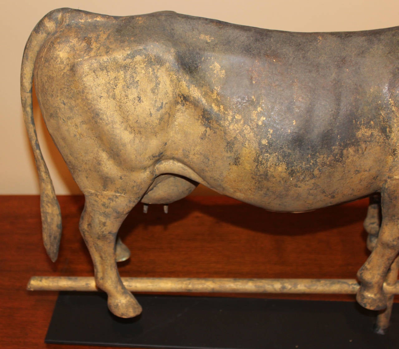 A nicely detailed weathervane with full body of a cow, zinc head and hollow copper body,  including  udder,  made by the J.W. Fiske & Co., New York City. Dates to the late 19th century.