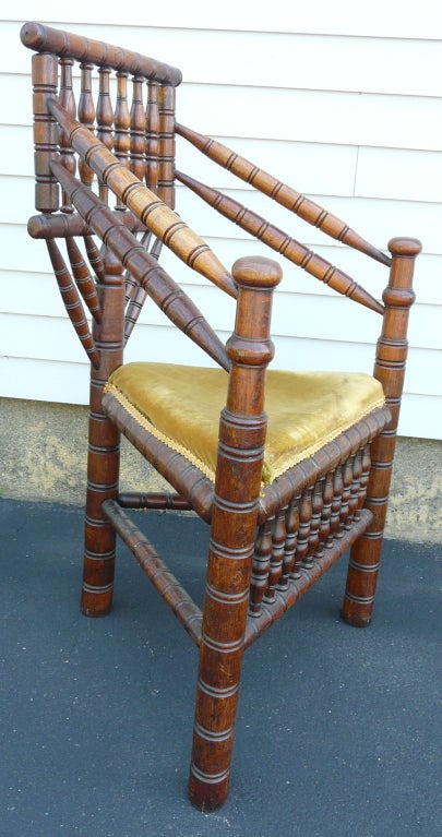 17th century-style turned wood corner chair with great form.  Upholstered seat.  Seat height is 19