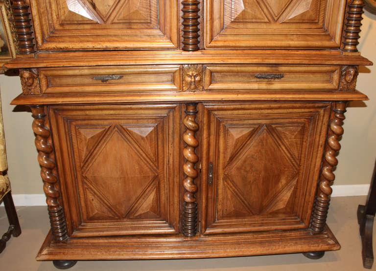 This is an example of a 17th century French Louis XIV Baroque flame walnut two part cupboard. Restoration for later conversion to an entertainment center.