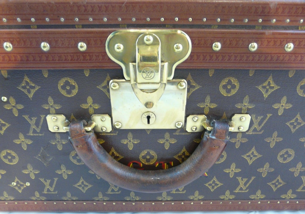 Louis Vuitton vintage hardside suitcase. Louis Vuitton monogrammed and embossed materials, leather trim and polished brasses. Largest suitcase made by Louis Vuitton. Lock number 110812. Circa 1930's.