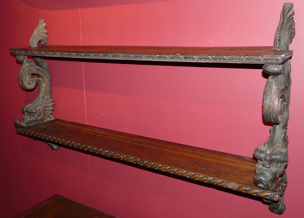 English Oak Carved Hanging Shelf With Dolphin Supports
