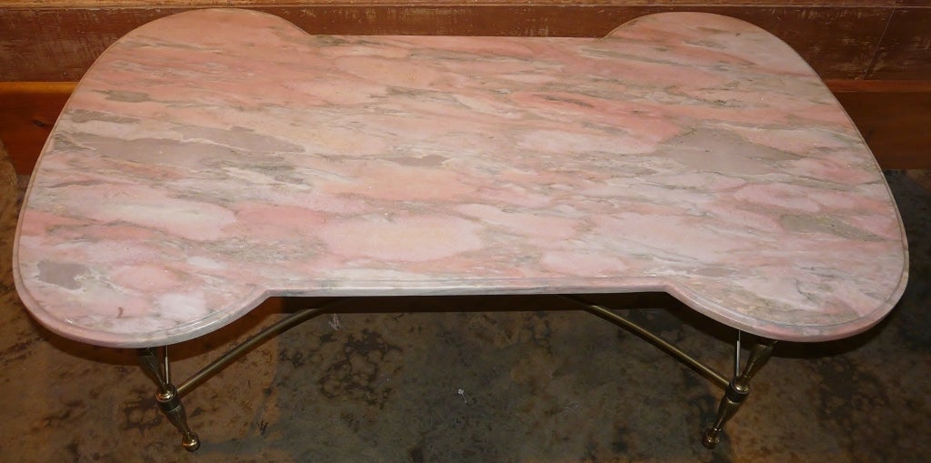 Hollywood Regency-style coffee table with Italian marble top, circa 1960.