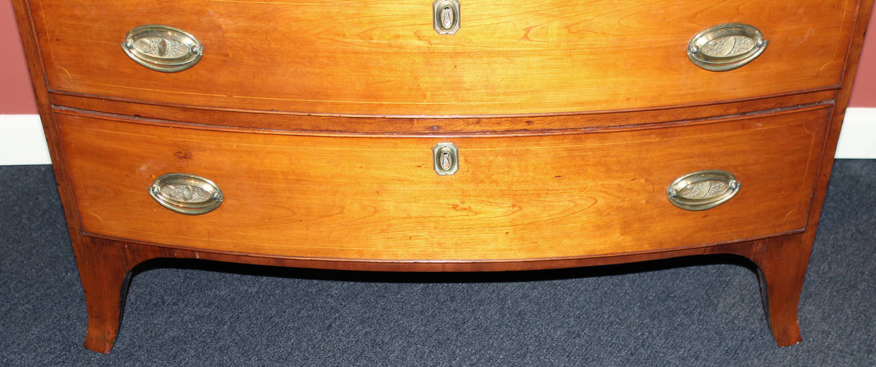 American Federal Period Cherry Four Drawer Swell or Bow Front Chest with Signed Brasses