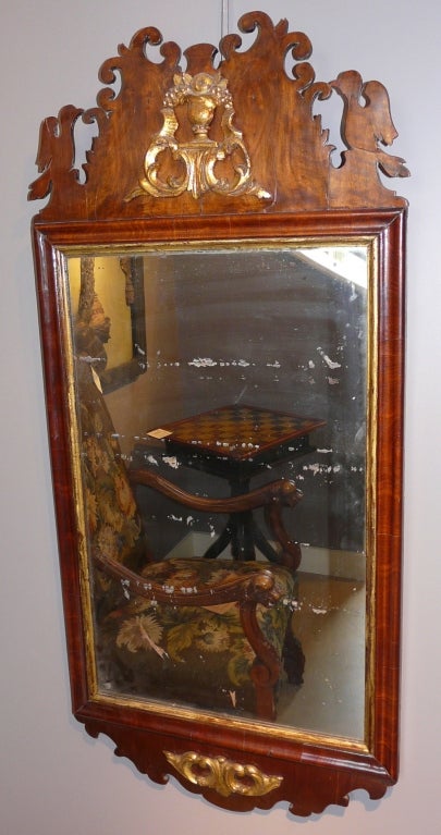 Chippendale mirror of mahogany with birds and gilded decoration. Either English or American.

Mirror sight size: 26.25