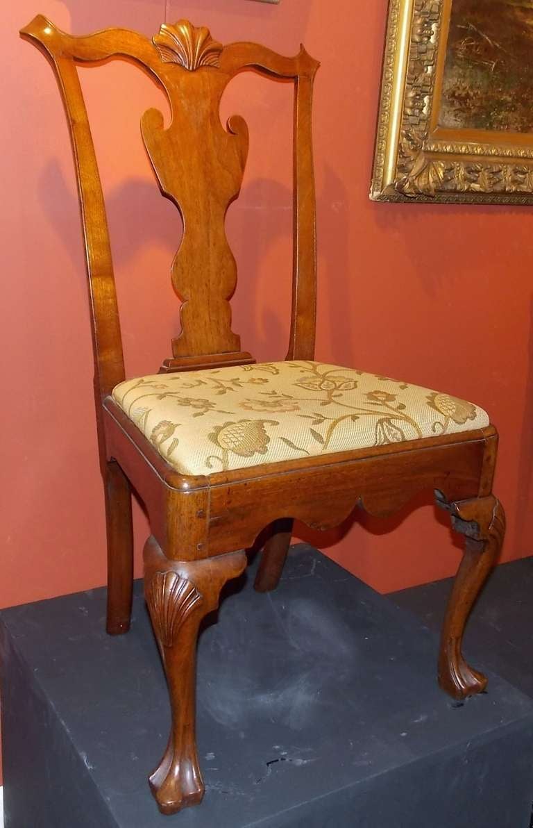 Philadelphia Chippendale walnut dining chair, circa 1760-1770, with shell carved crest and pierced splat, over trapezoidal slip seat with shaped rail and shell carved legs ending in trifid feet.  Provenance: Elliot and Ruth Herman Collection.