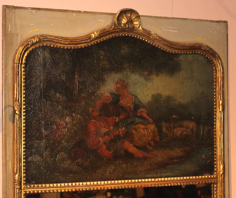 19th century French Trumeau mirror. Romantic painting in oil on canvas above mirror plate all framed in gilt wood with polychrome decoration.