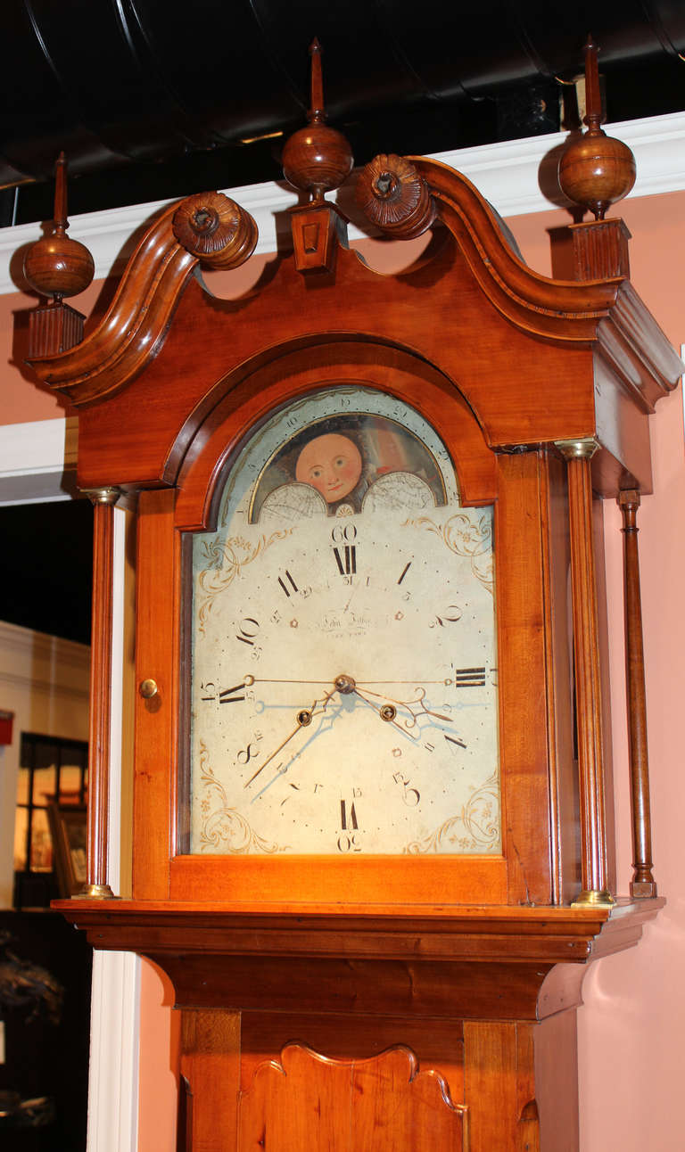 A fine cherry cased four handed tall clock with moon phase dial. 8 day brass movement, chiming on the hour. John Fisher (1736-1808) was a German immigrant who resided in York, Pennsylvania at the time of the American Revolution. He was intimate with