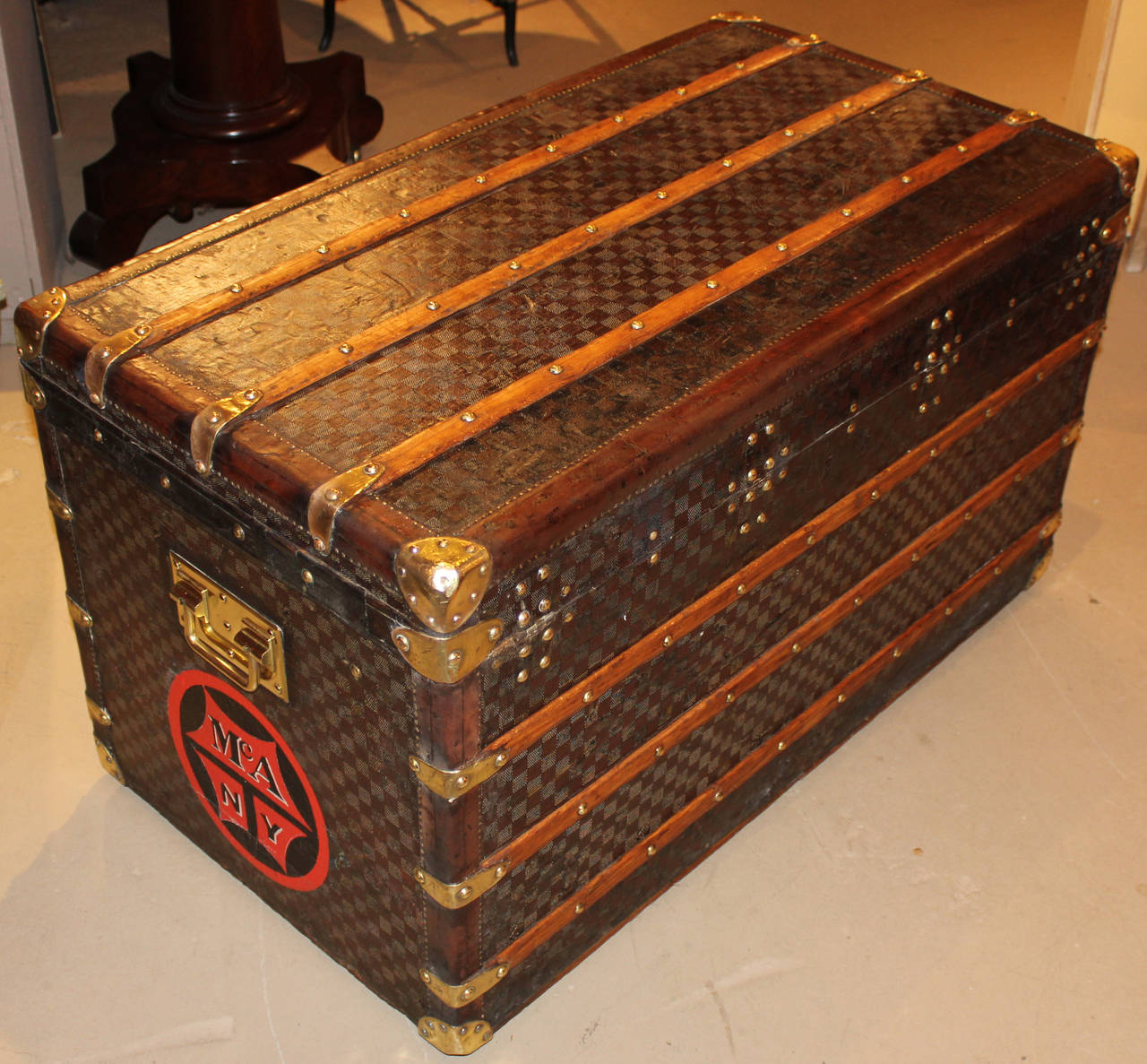A fabulous Louis Vuitton steamer trunk with early checkerboard canvas exterior, S/N 44780, circa 1890, with birch slats, brass findings, linen interiors with original trays, zinc bottom (found only on the best quality trunks),padded interior cover