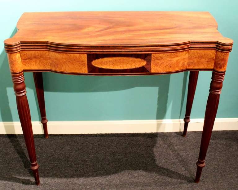 A fine Federal gaming table circa 1810-1820 with superbly figured mahogany and flame birch inlaid card table in the Sheraton taste.  Probably Portsmouth, NH.  Provenance: The Elliot and Ruth Herman Collection.