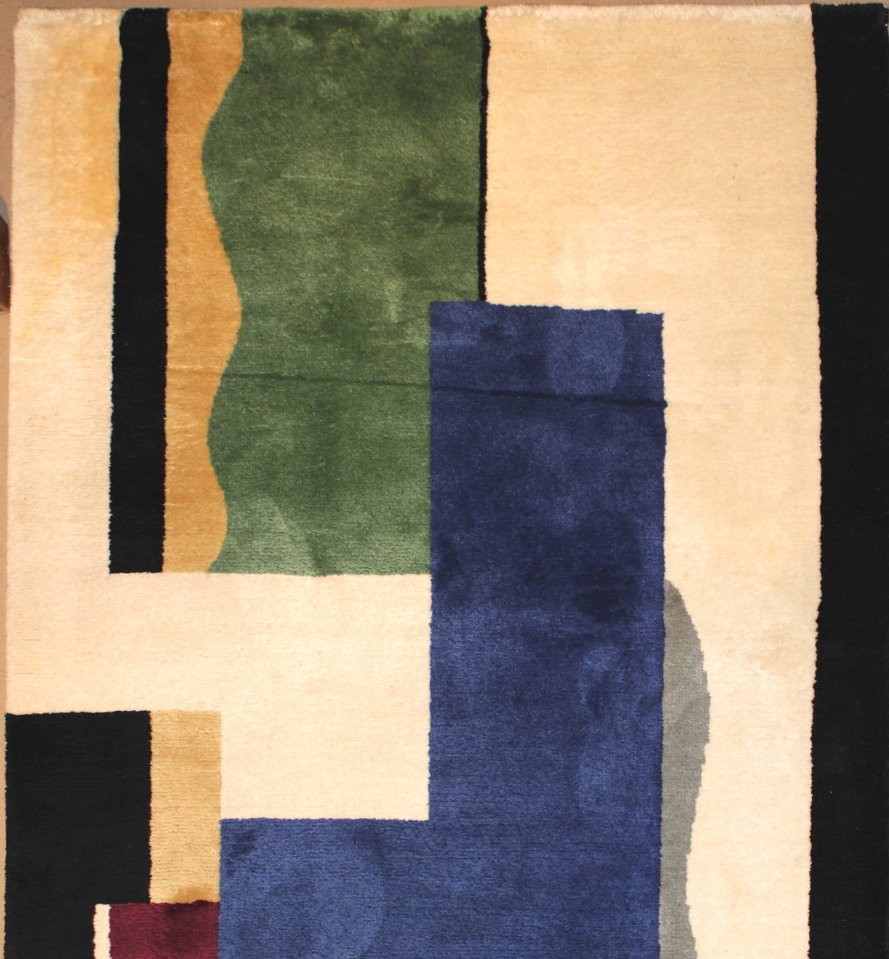 This wool carpet, rug or tapestry titled “Blanc” was conceived from a cartoon drawing prior to 1930 by French artist Fernand Leger (1881-1955). Leger was born in Normandy, France and went on to become one of the major cubist painters in France in