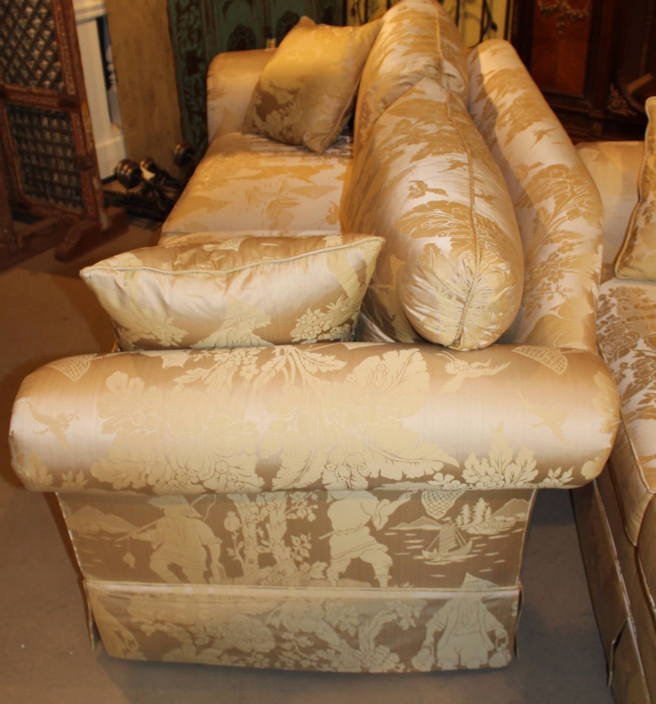 A pair of beautiful Chinoiserie silk upholstered sofas with matching pillows, made by Kindel Furniture Company, Grand Rapids, Michigan. The back pillows are partially made with waterfowl feathers and grey duck down, with the throw pillows made with