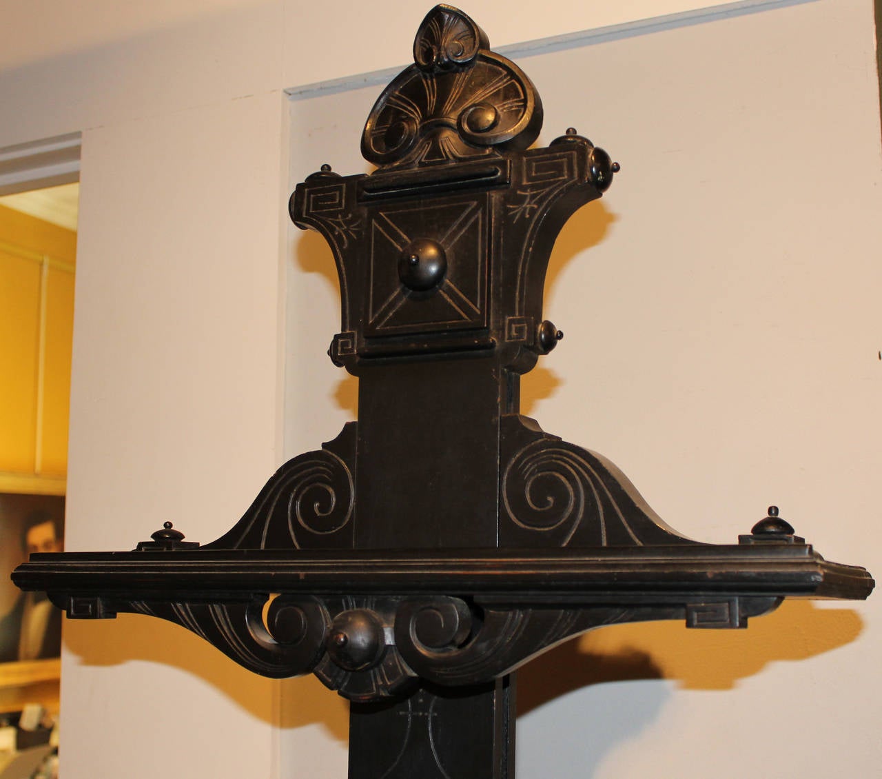 A fine example of a 19th century Aesthetic Movement ebonized wood easel with incised decoration. Provenance: The Ernest A. Rohdenburg III estate.