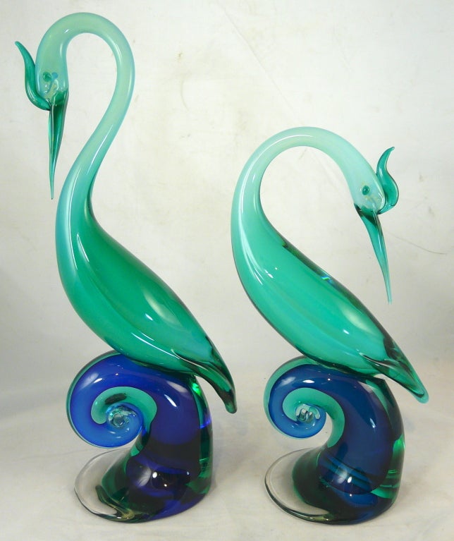 Pair of tall Murano glass blue birds by Antonio Salviati ca. 1950.  One of the figurines still has the original factory sticker.  The larger bird measures 16