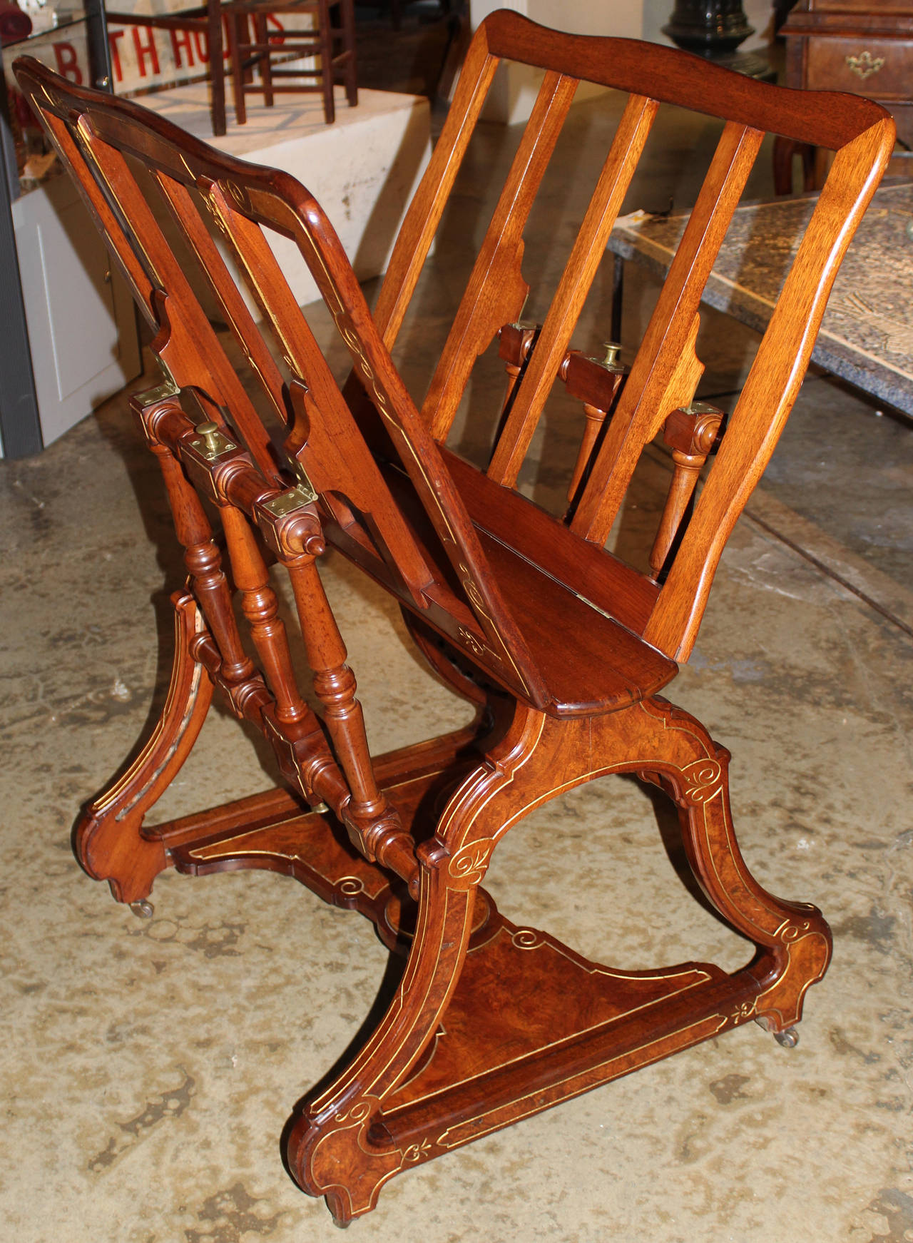 A fine Aesthetic Period metamorphic portfolio stand or easel with adjustable sides, circa 1880, with  burled veneer, incised geometric decoration with gilt highlights, and brass hardware, including casters.